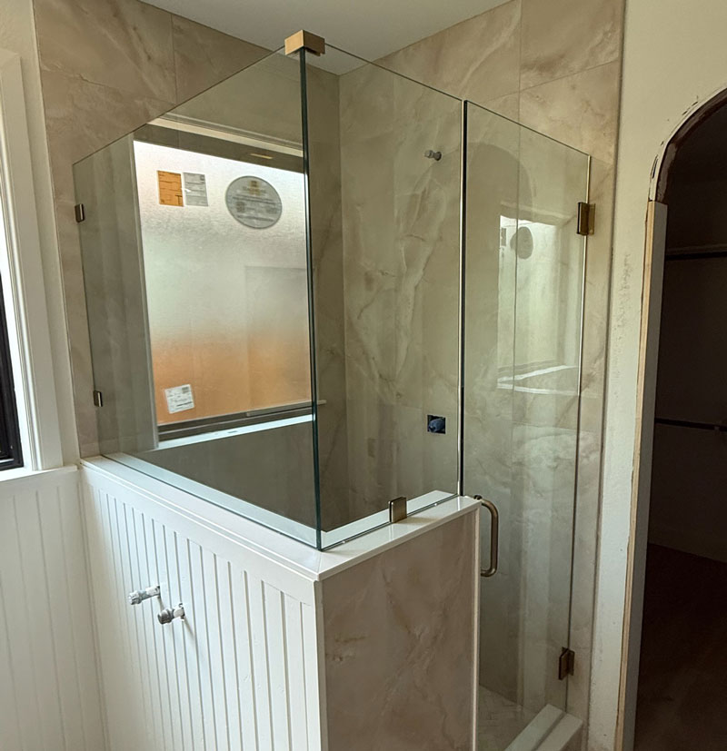 Bathroom-shower-image-2 A walk-in shower with glass doors installed by Northern Hills Glass & Mirror