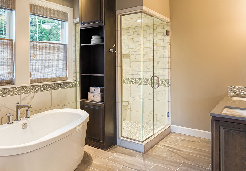 Bathroom showing a tub and shower enclosure
