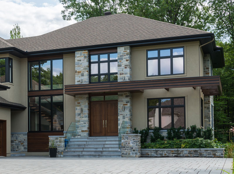 Home-exterior home exterior with a lot of windows