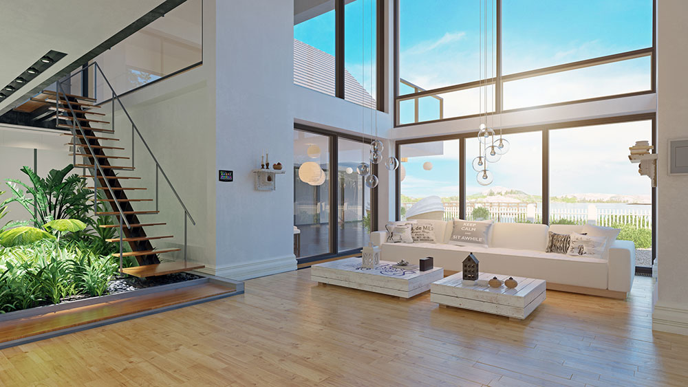 Room-with-large-glass-windows-and-stairs-with-glass-railing Large living room with large glass windows and glass half railing on the stairs