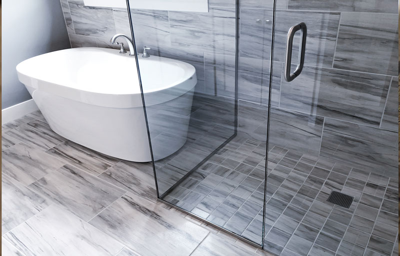 Shower-and-tub Bathroom with a frameless glass shower