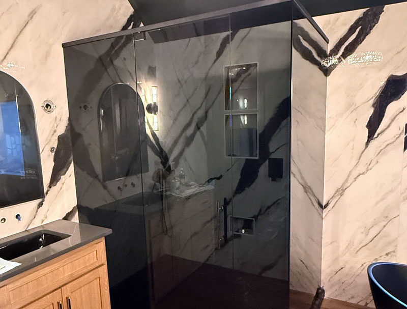 Shower-glass-with-a-dark-Grey-texture shower enclosure with grey tinted glass